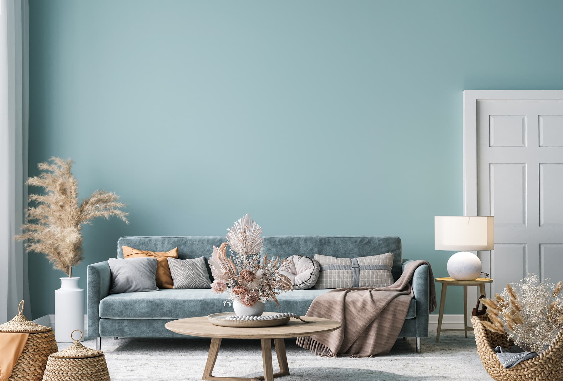 Living room with a freshly painted sage green wall